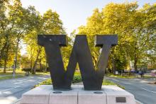 Bronze W at campus entrance