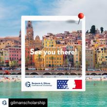 Buildings on waterfront in French town with Gilman Scholarship logo image frame on top and text "See you there!"