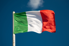 Italian flag against blue sky