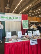 A table selling books at the Festa Italiana Seattle 