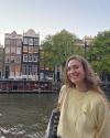 Picture of myself in front of traditional houses in Amsterdam