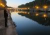 Josh Gailey plays the trumpet along the Tiber in Rome