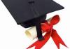 black graduation cap and diploma