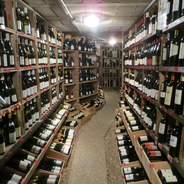 A wine cellar with various French wines